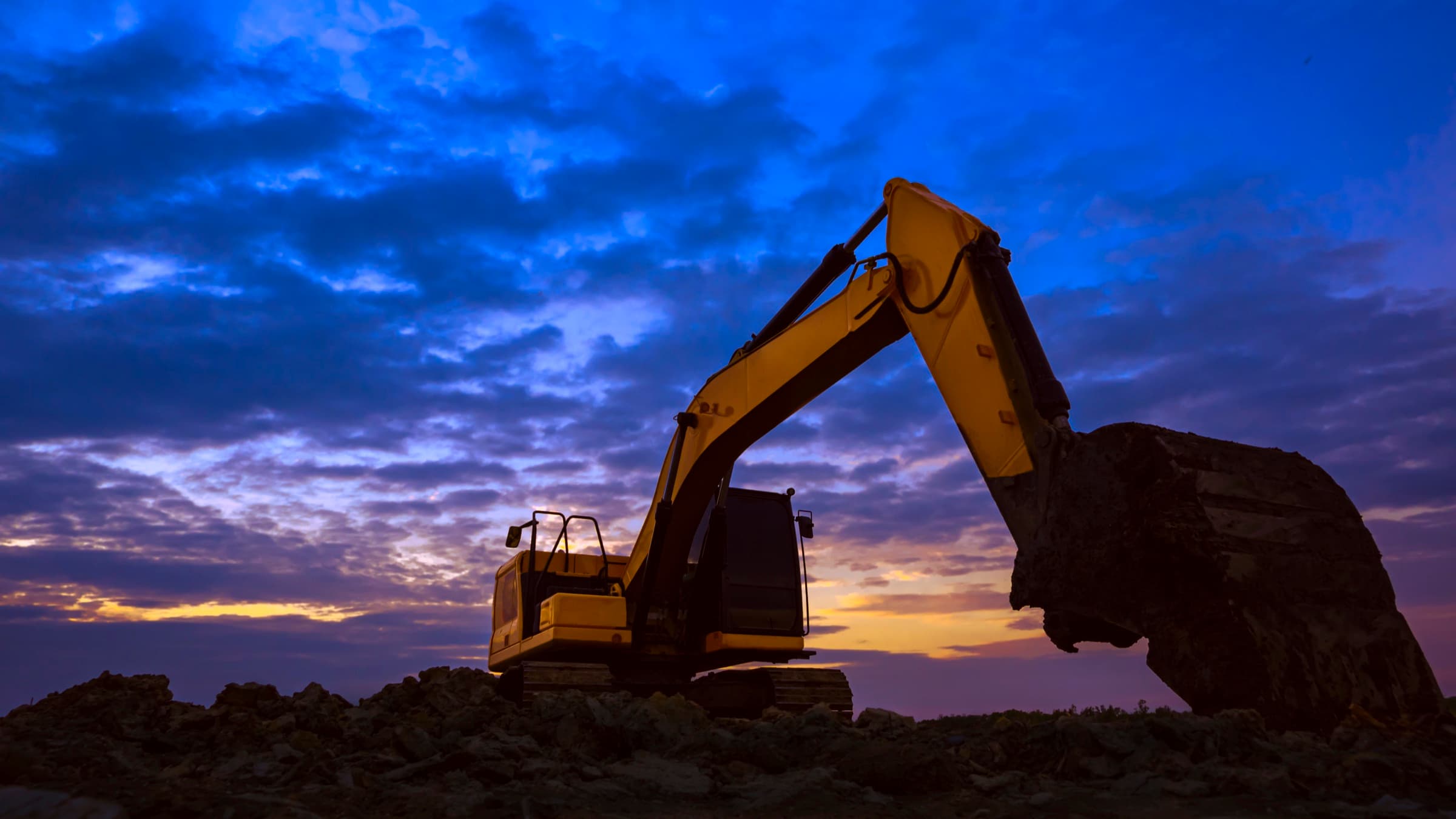Excavator at sunset