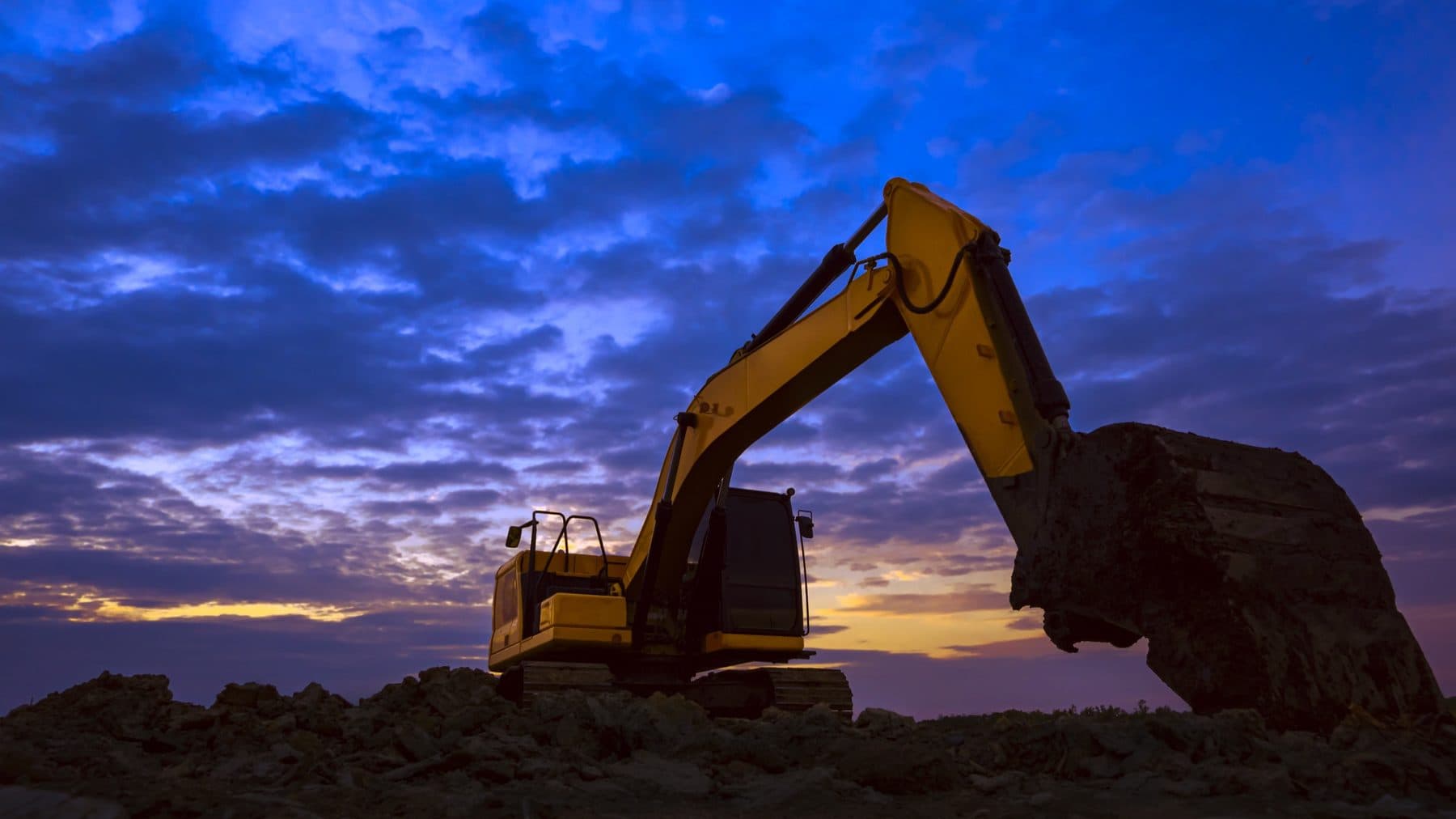 Excavator at sunset