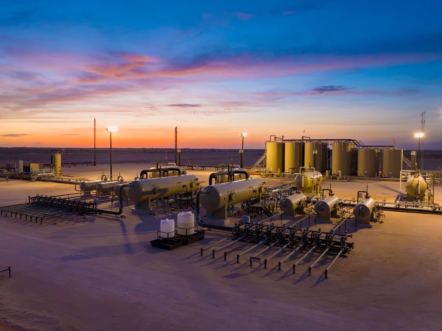 Tank battery facility at sunset