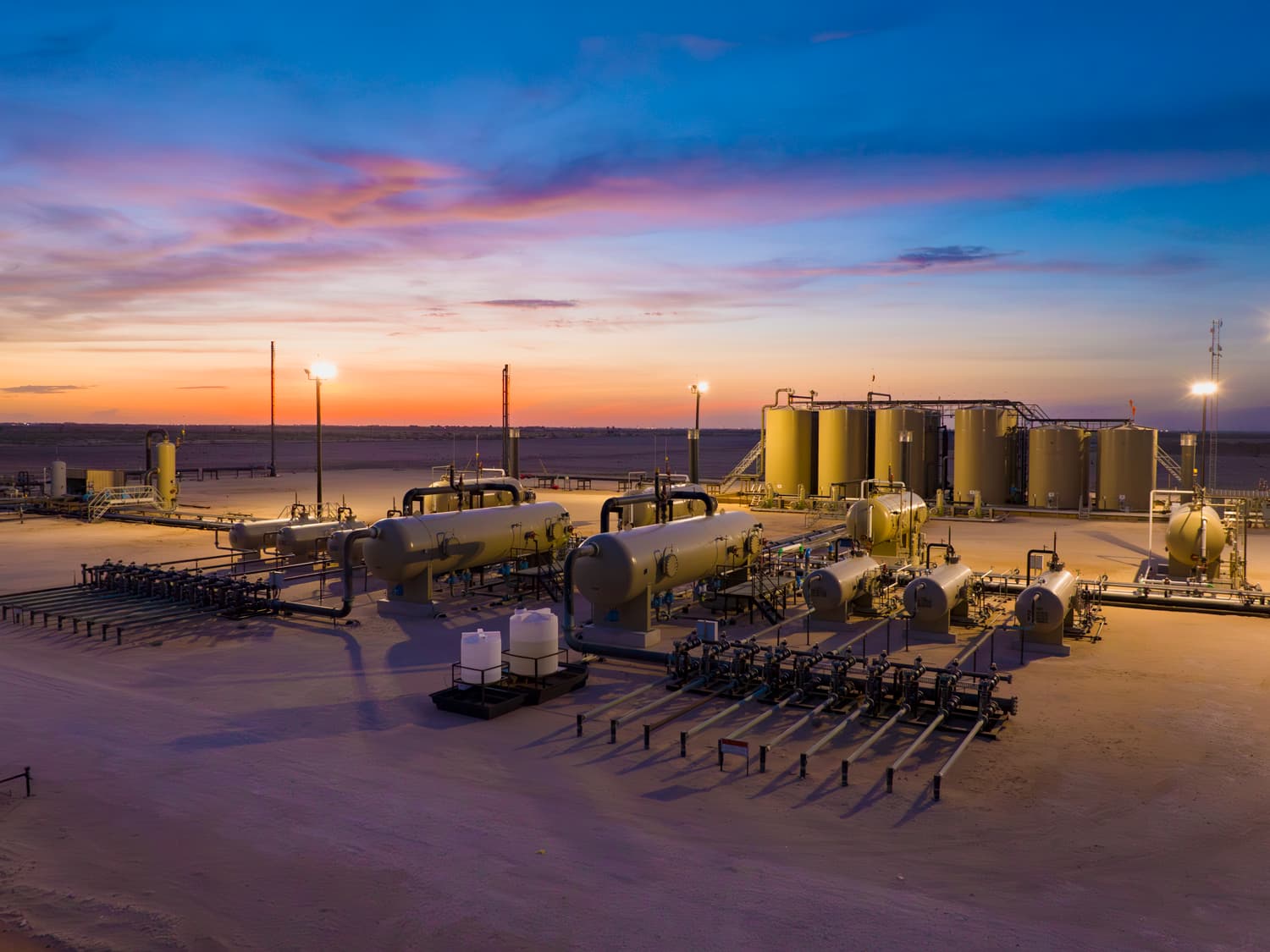 Tank battery facility at sunset